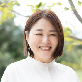 企画　根津賀恵